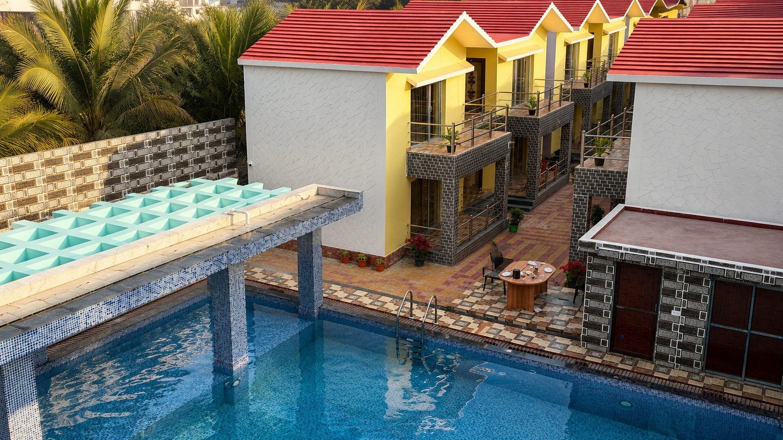 Aerial view of pool and cottages at Royal Villa Resorts Mandarmani